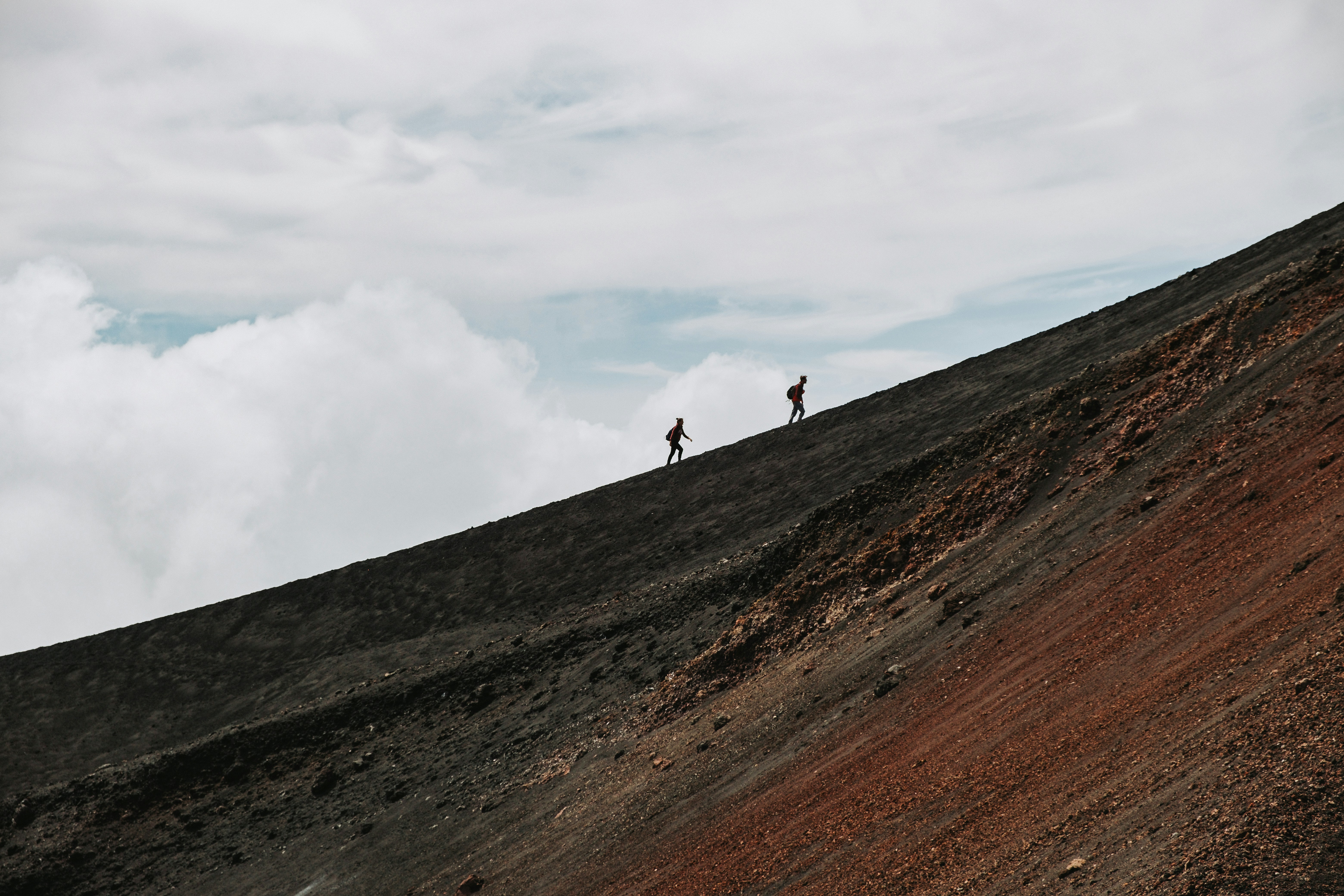 Travelers hiking across a volcanic slope in Nicaragua